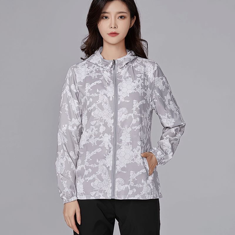 Sun-protective waterproof women's windbreaker jacket with zipper, perfect for outdoor adventures like hiking and camping.